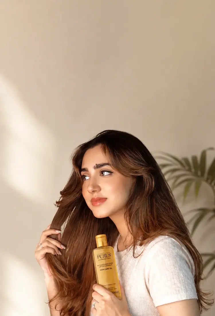 Model carry agan oil bottle in hand